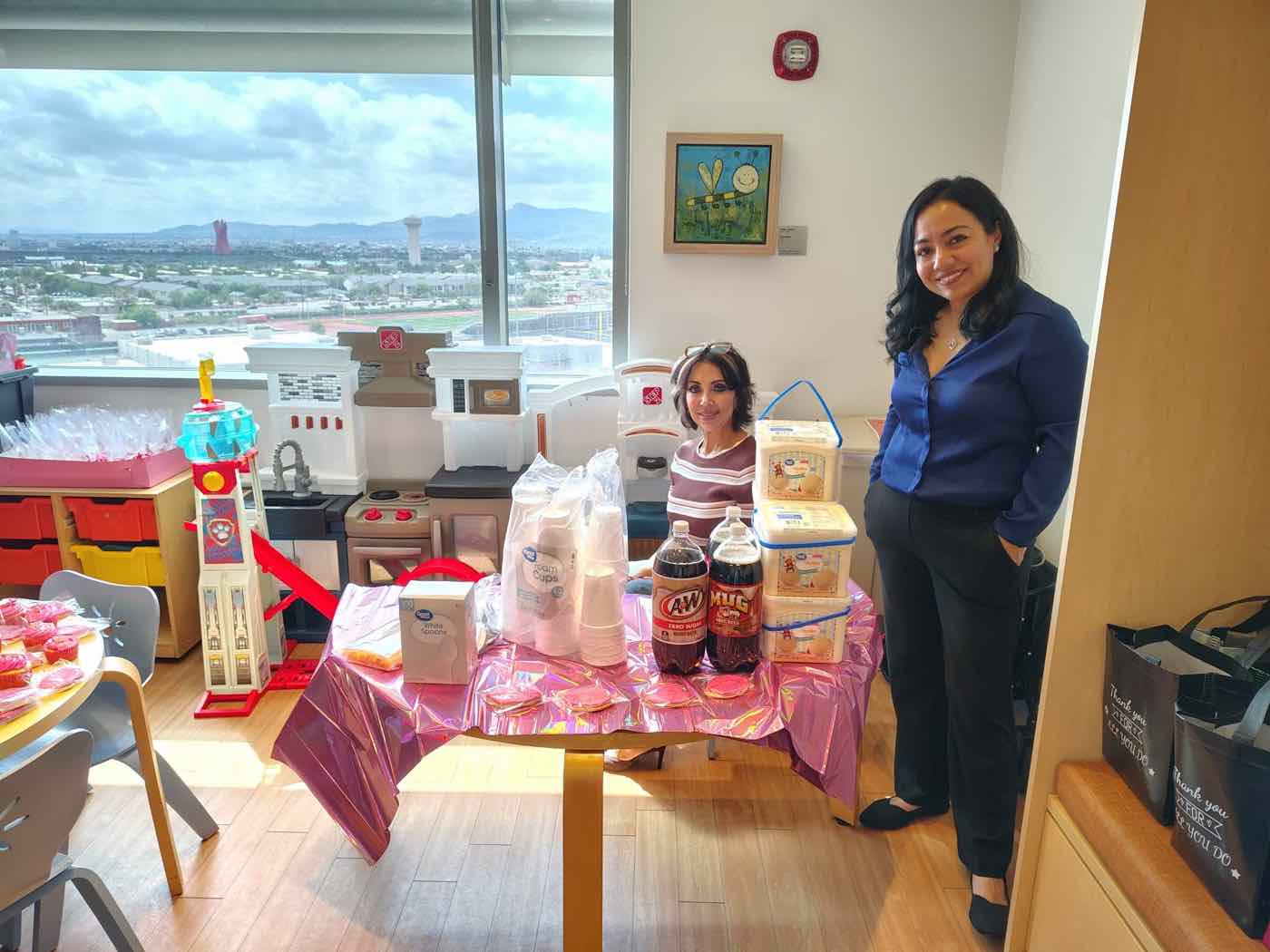 Abundant Home Health team members with a birthday party set up in a hospital playroom